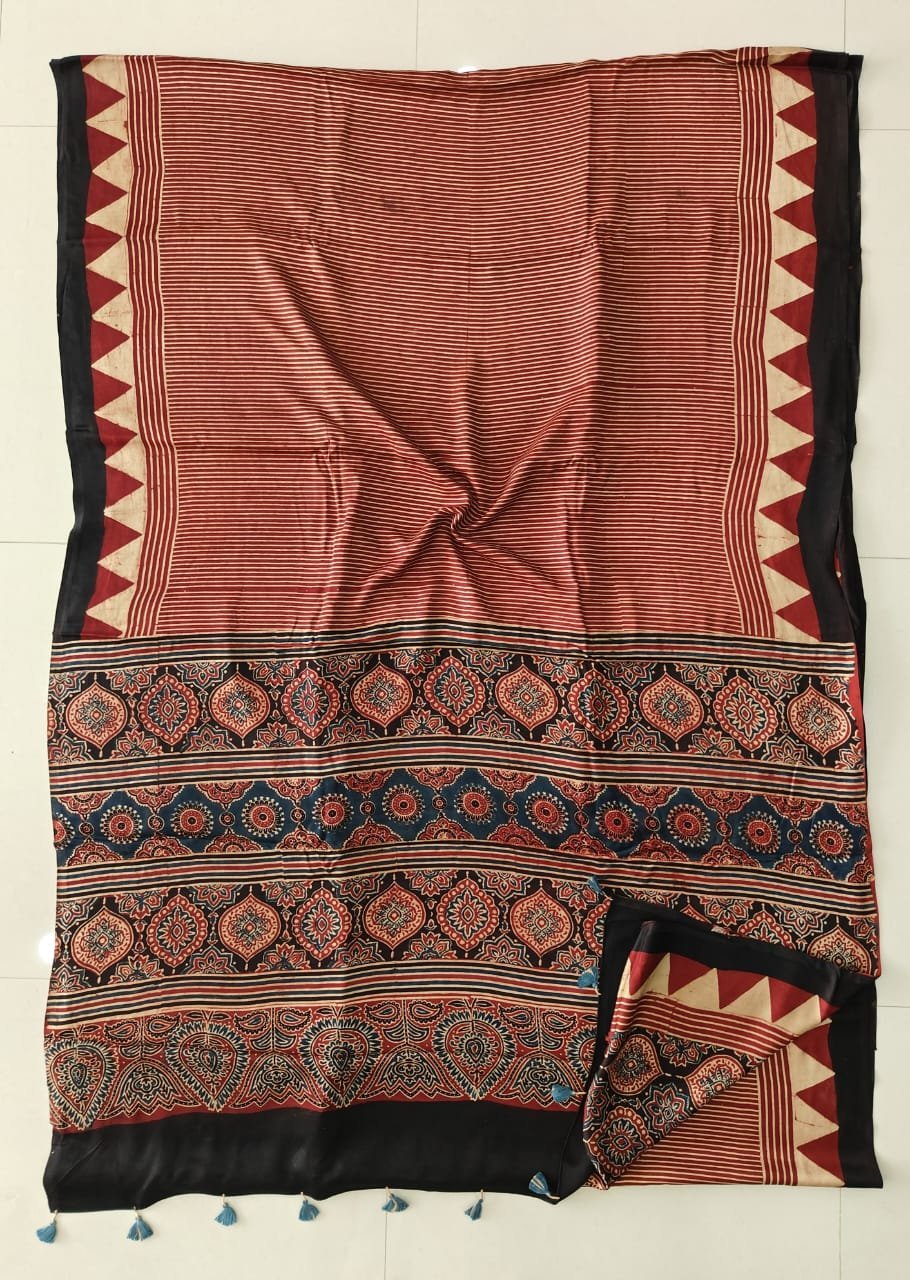 Rust red striped Ajrakh print pure Modal silk saree with medallion pallu and blue tassels