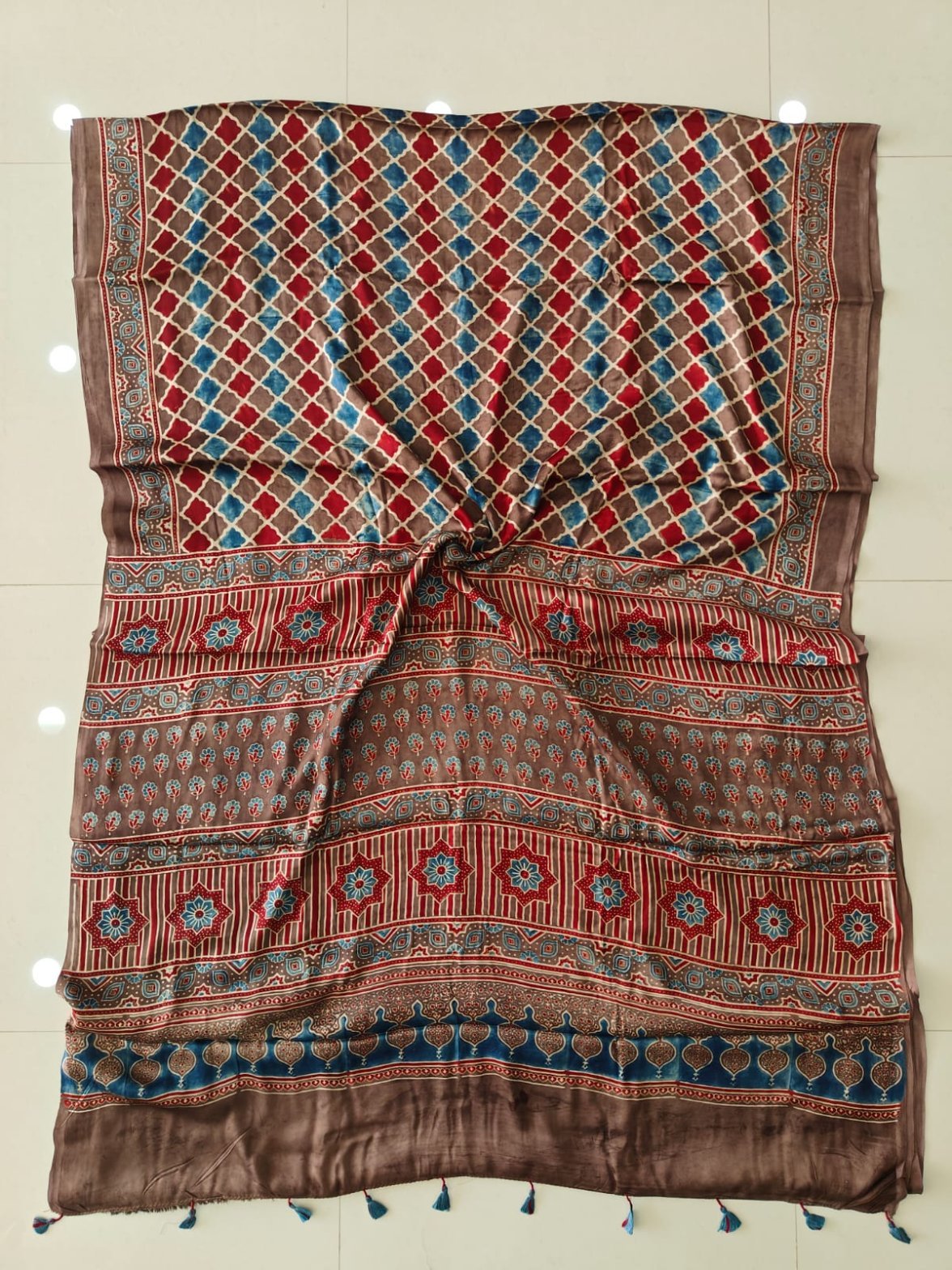 Brown Ajrakh print pure Modal silk saree with diamond lattice pattern and blue tassels