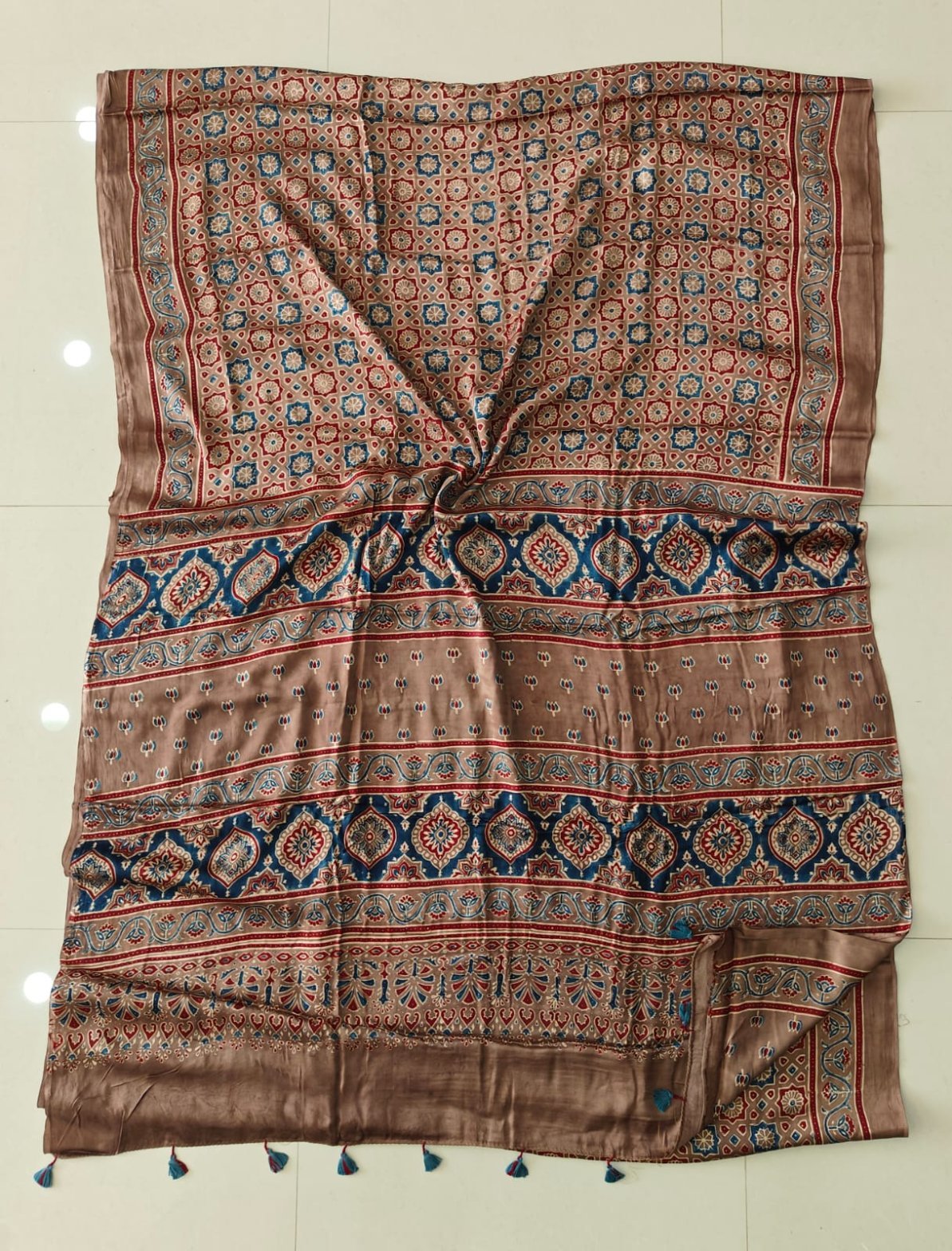 Beige and blue Ajrakh print pure Modal silk saree with floral medallion border and tassels