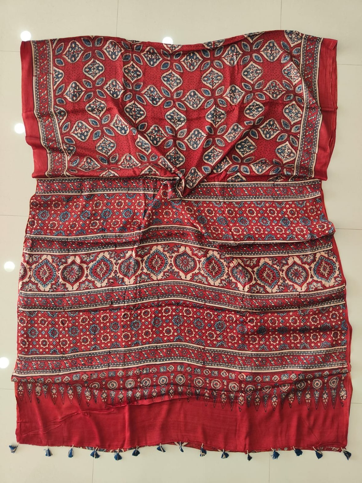Red Ajrakh print pure Modal silk saree with blue floral medallion pattern and tasseled pallu