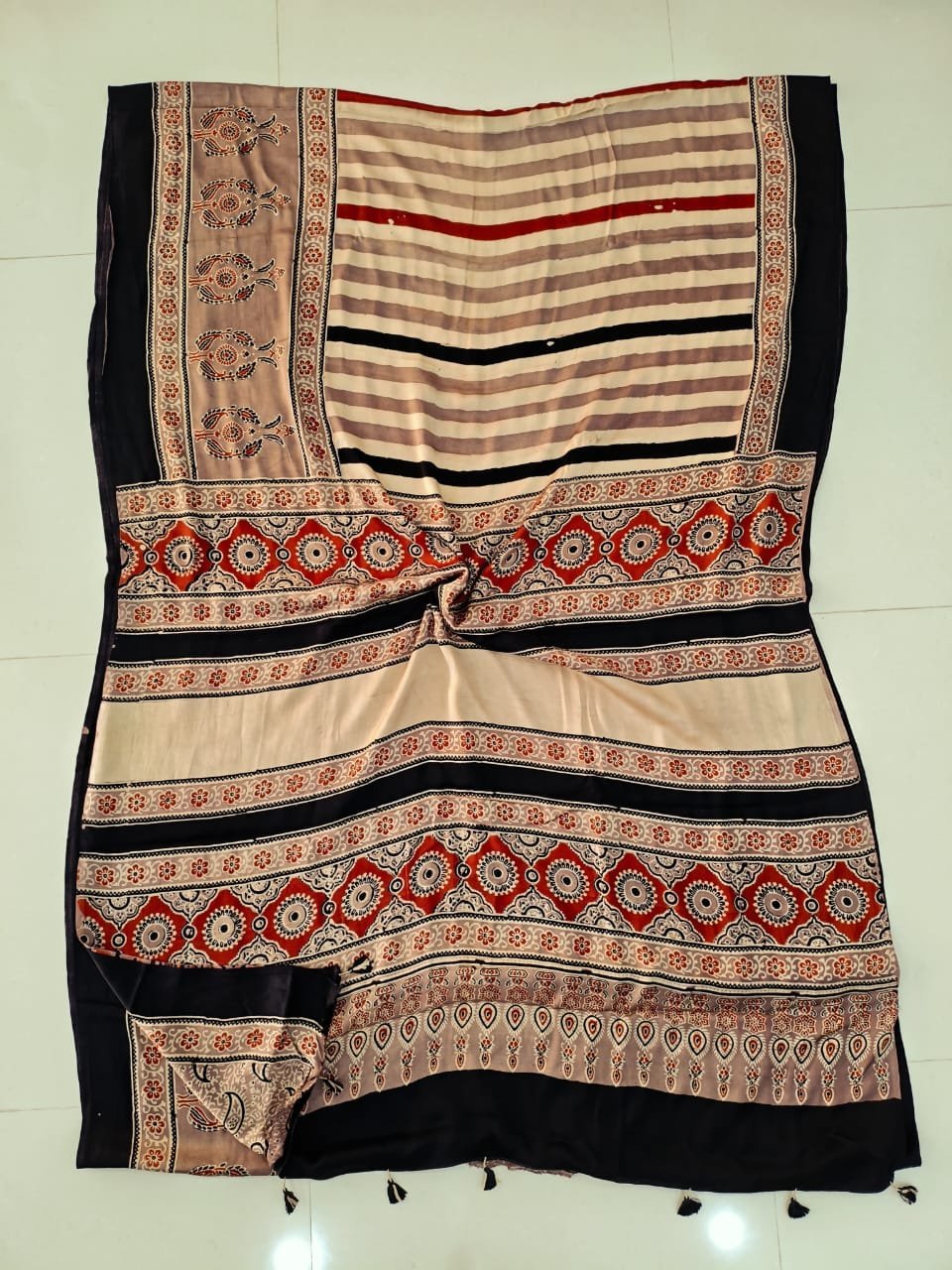 Black and beige striped Ajrakh print pure Modal silk saree with floral medallion pallu border