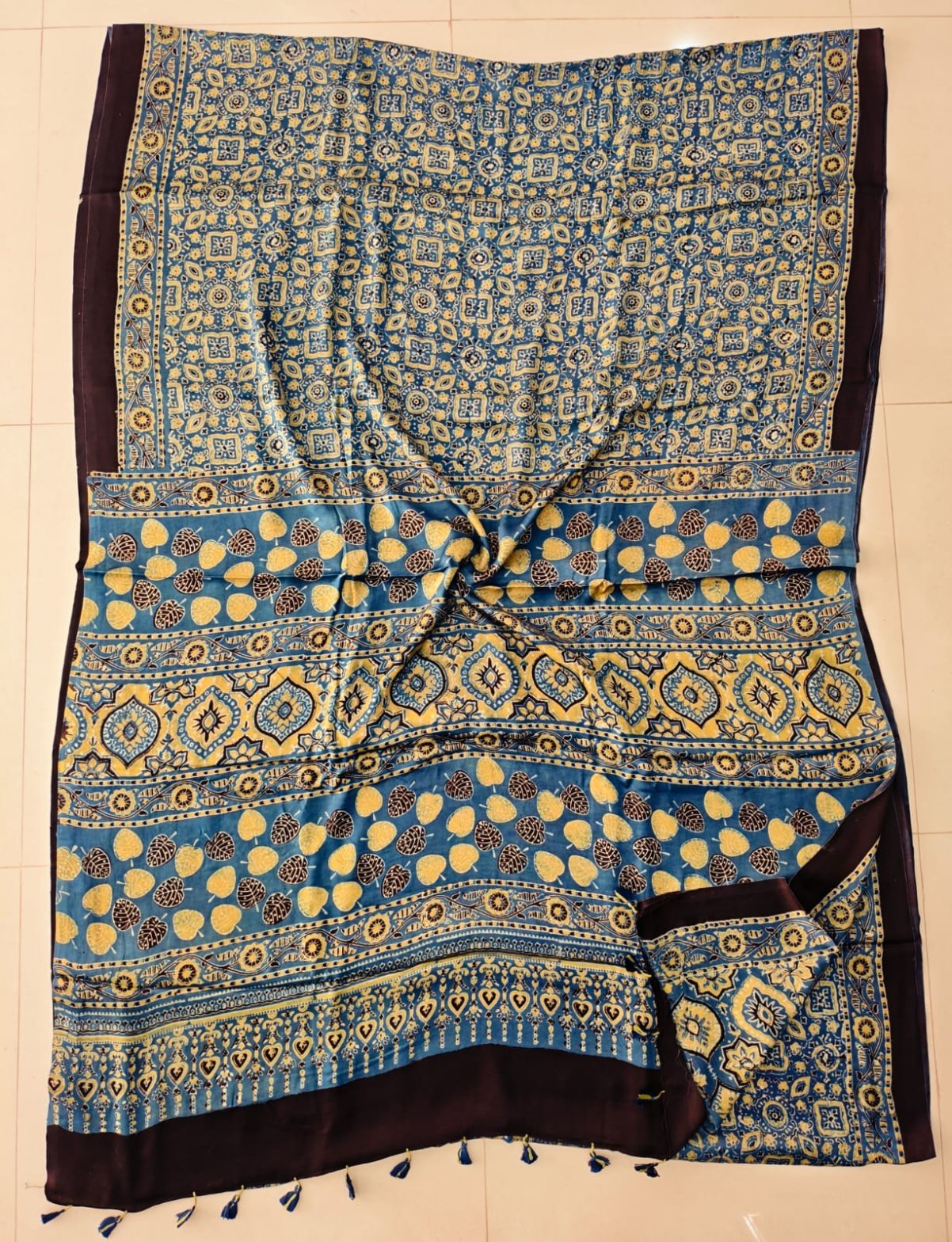Teal blue Ajrakh print pure Modal silk saree with plum border and tasseled pallu