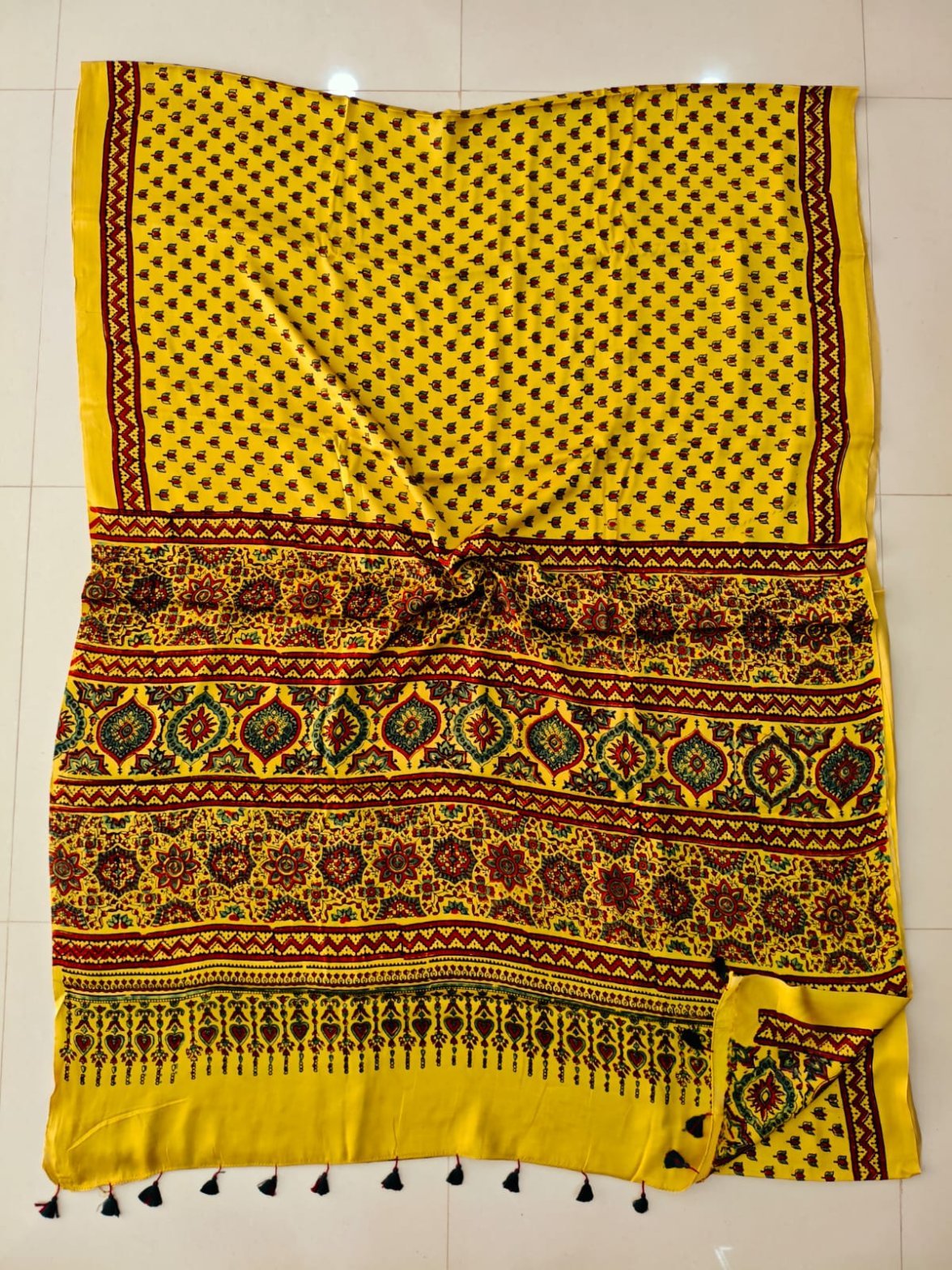 Yellow Ajrakh print pure Modal silk saree with floral booti body and heart finial pallu border