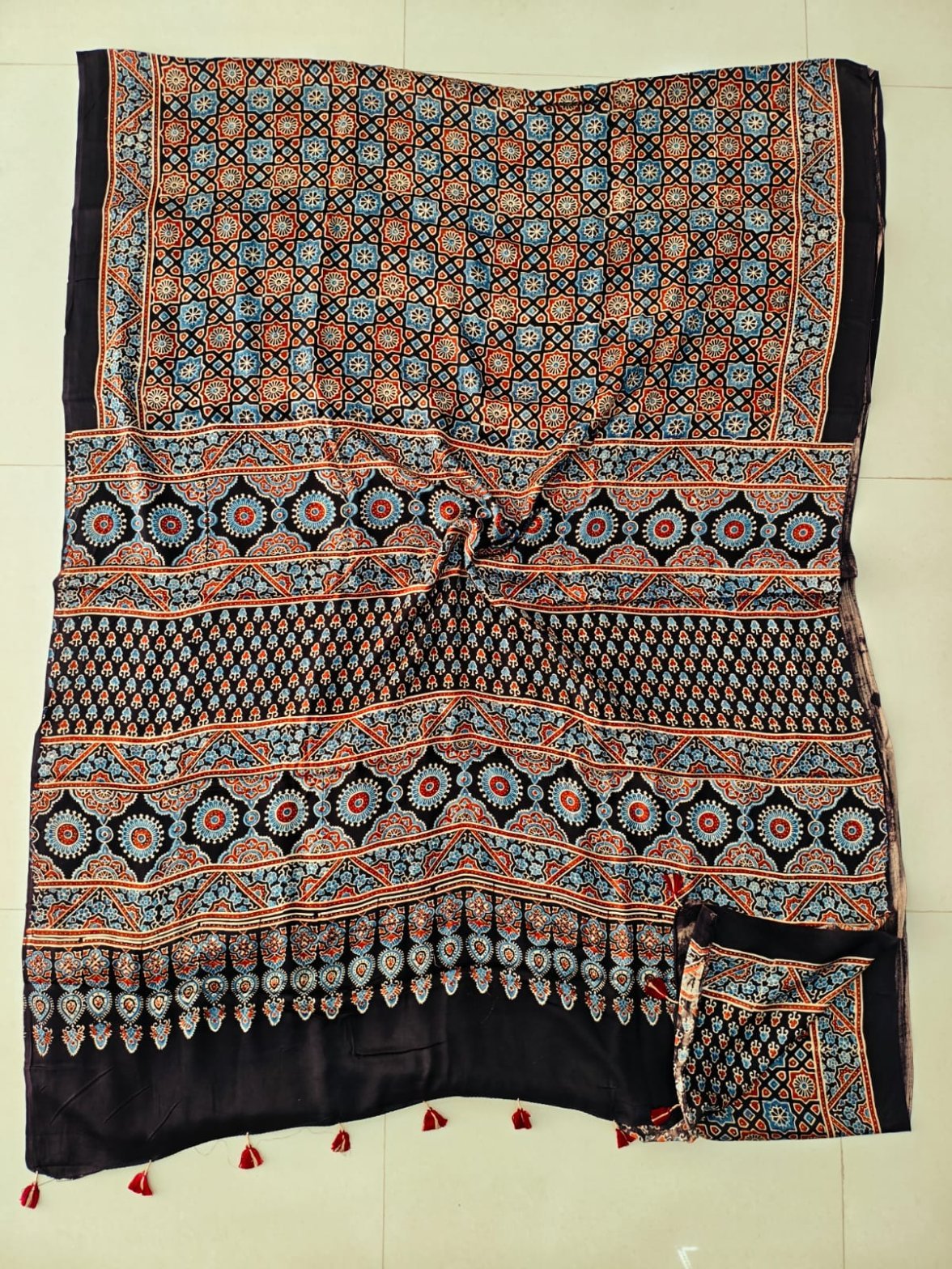 Black and blue Ajrakh print pure Modal silk saree with circular medallion pallu border
