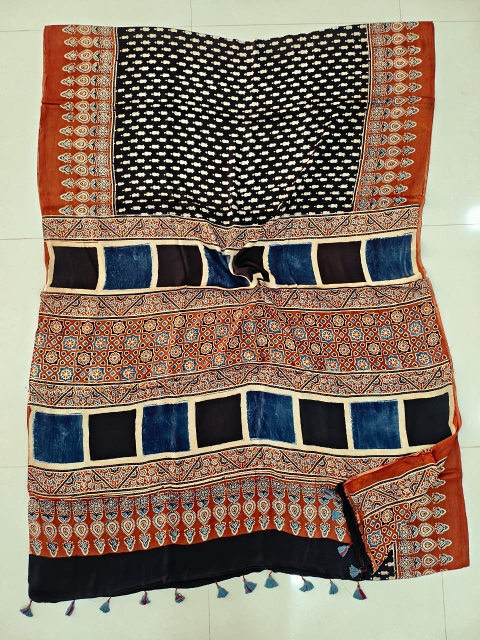 Black and rust Ajrakh print pure Modal silk saree with checkerboard pallu border