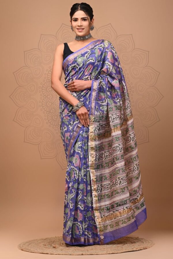 Woman draped in violet-blue hand block printed Maheshwari silk saree with floral border