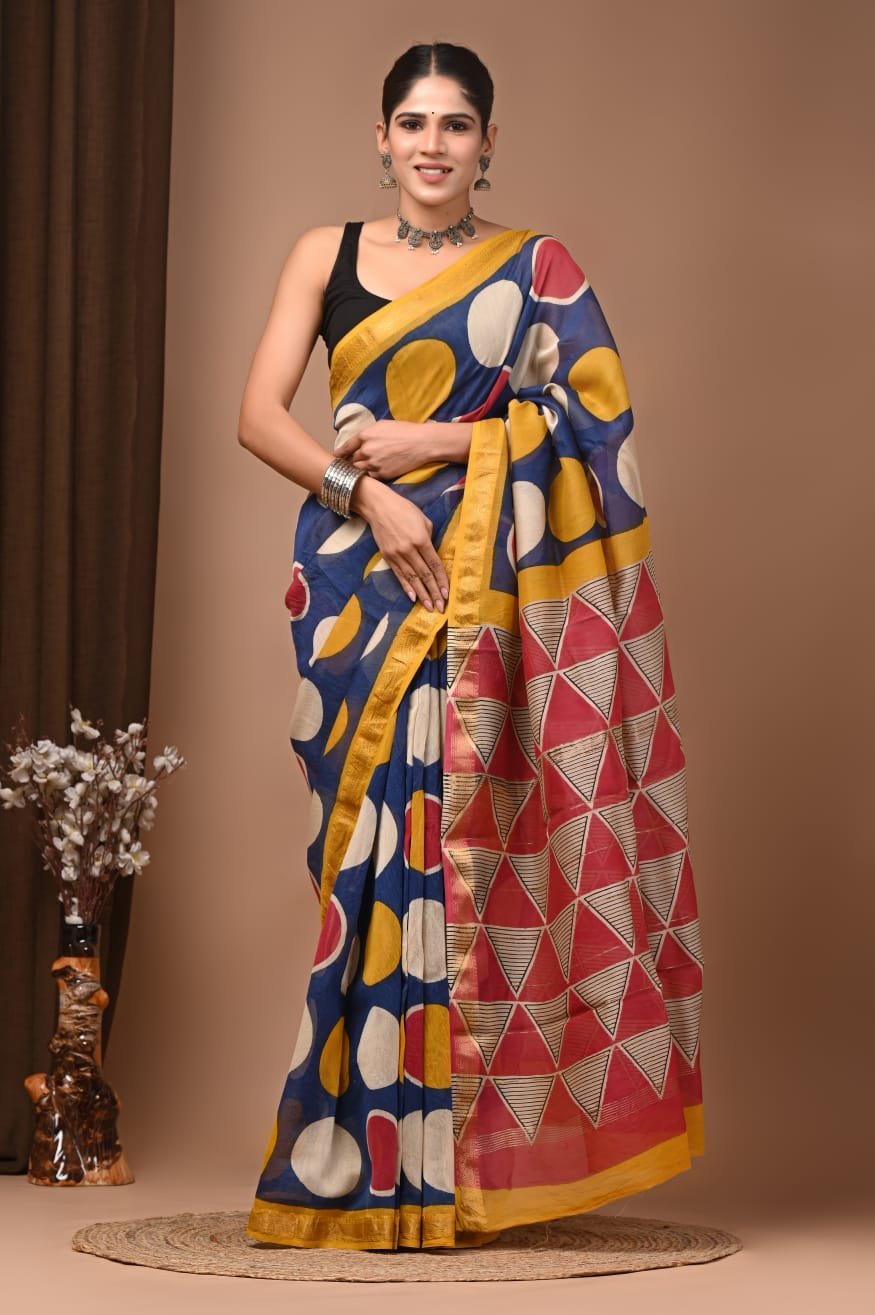 Woman wearing navy blue hand block printed Maheshwari silk saree with circle print and triangle pallu