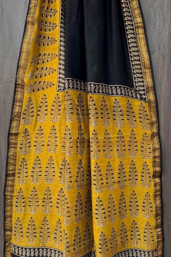 Mustard yellow hand block printed Maheshwari silk saree with black feather motifs and zari border