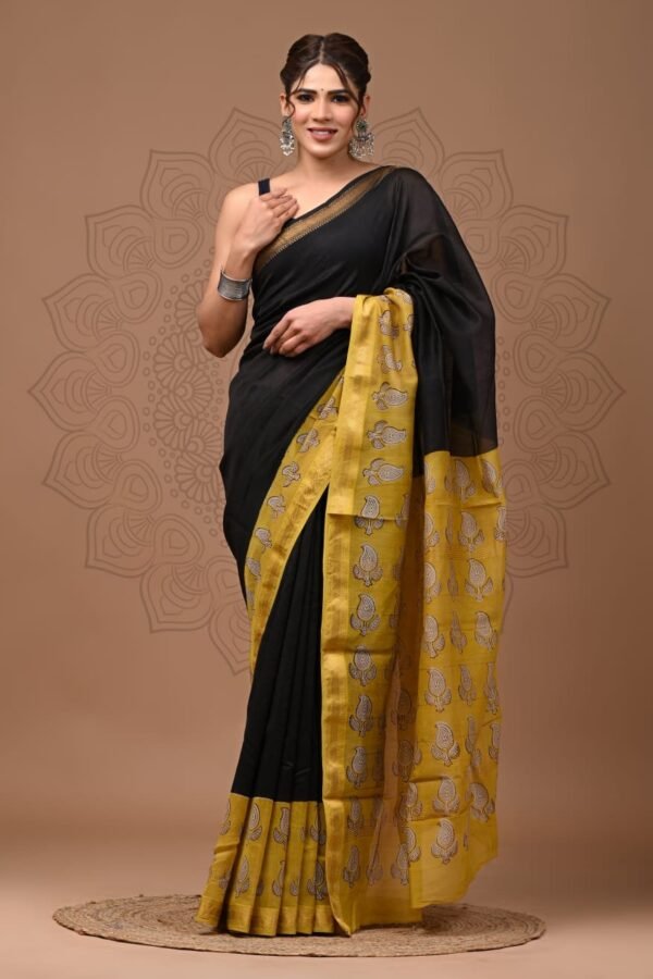 Woman wearing black Maheshwari silk saree with mustard yellow hand block printed paisley border and pallu