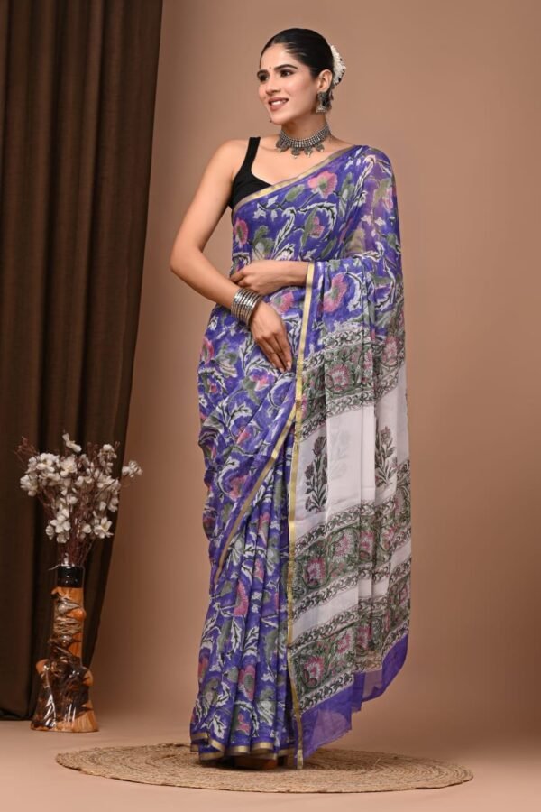 Woman in violet-blue hand block printed chiffon saree with floral motif and ivory border