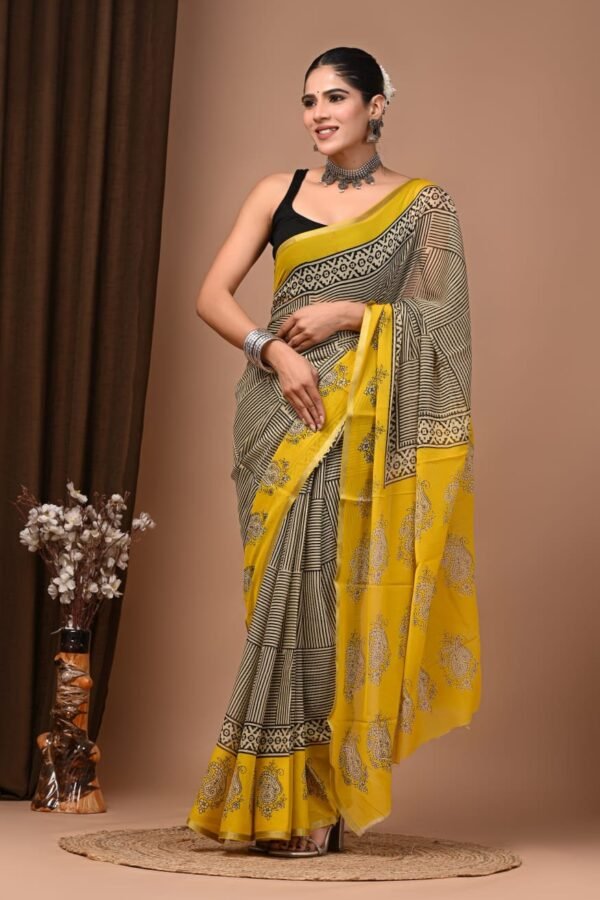 Woman wearing yellow and black hand block printed chiffon saree with striped grid pattern and paisley border pallu