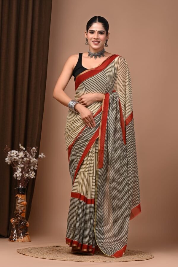 Woman wearing ivory hand block printed chiffon saree with black stripe check pattern and red border
