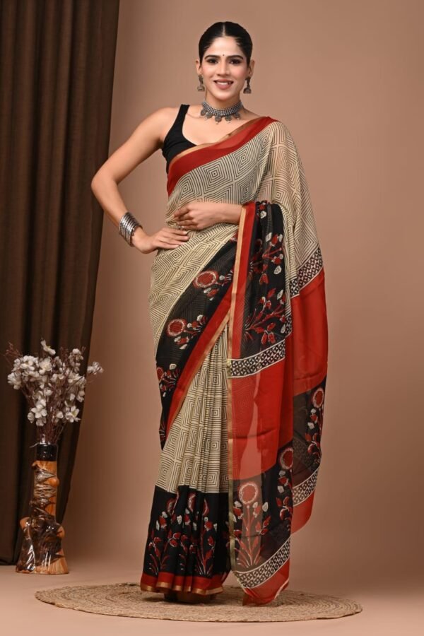 Cream hand block printed chiffon saree with diamond grid pattern and black-red floral border, draped on model