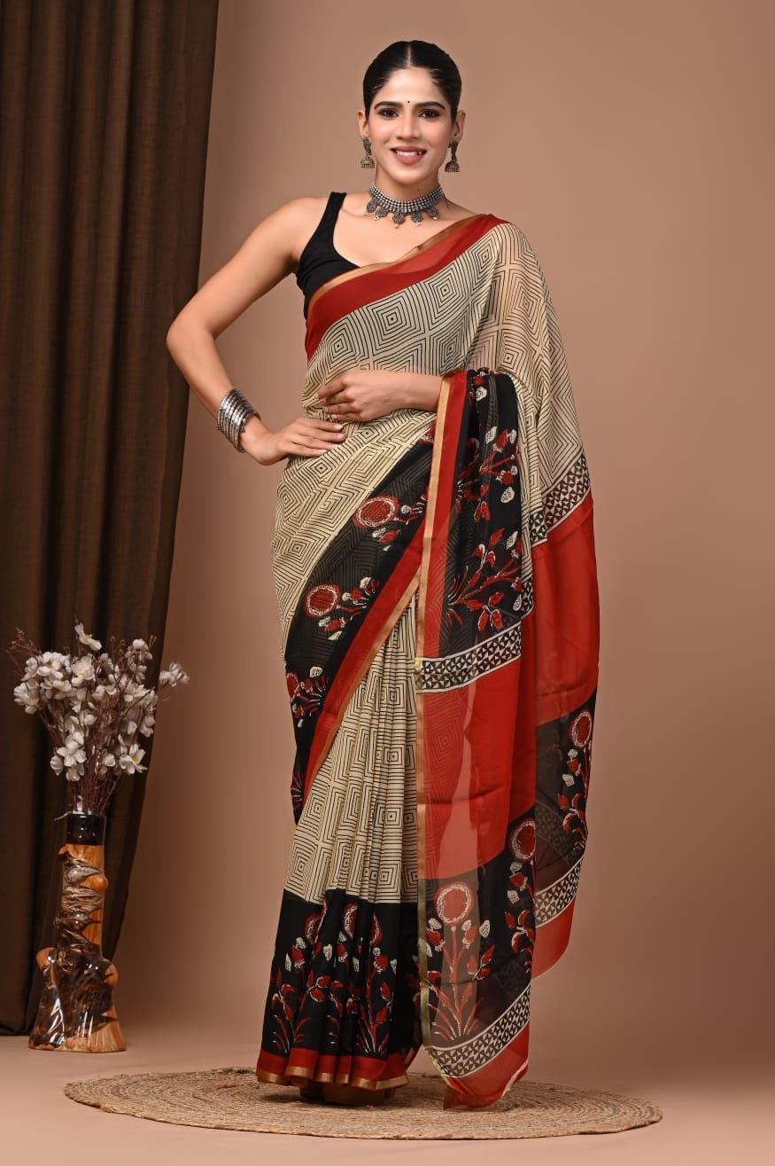 Cream hand block printed chiffon saree with diamond grid pattern and black-red floral border, draped on model