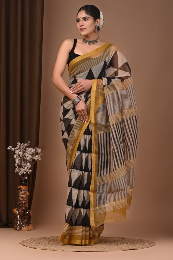 Woman wearing black and beige Kota Doria cotton saree with geometric triangle print and mustard border