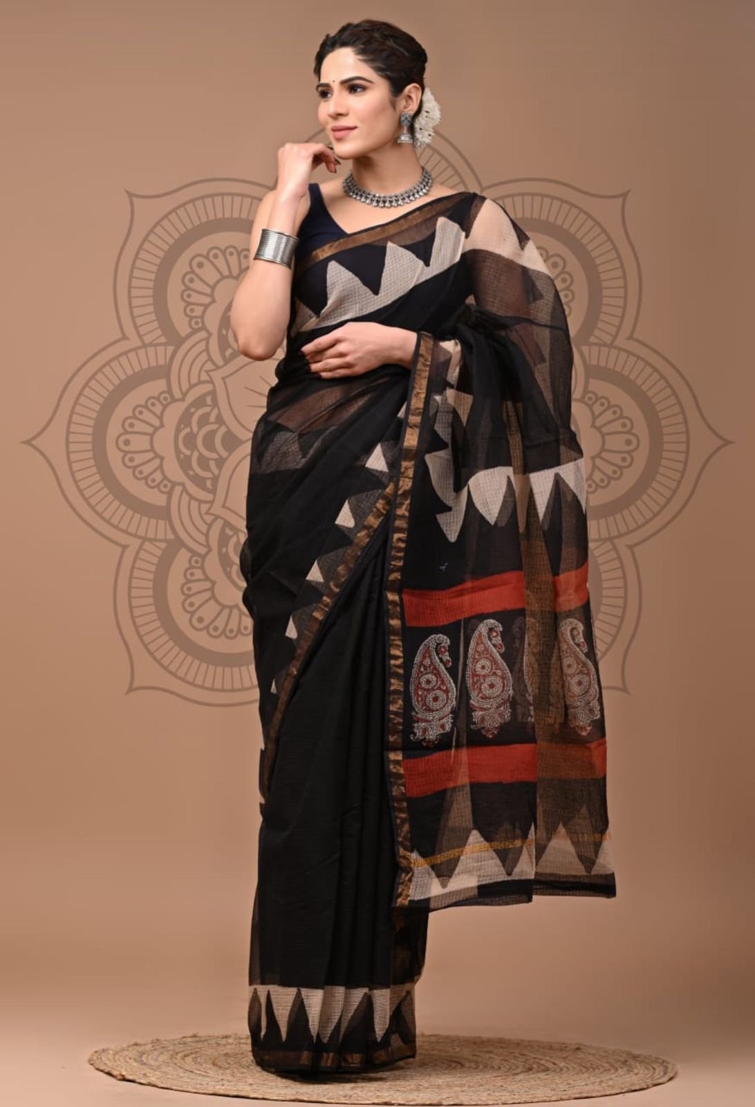 Black Kota Doria cotton saree with triangle temple border print and paisley pallu, styled with jewelry