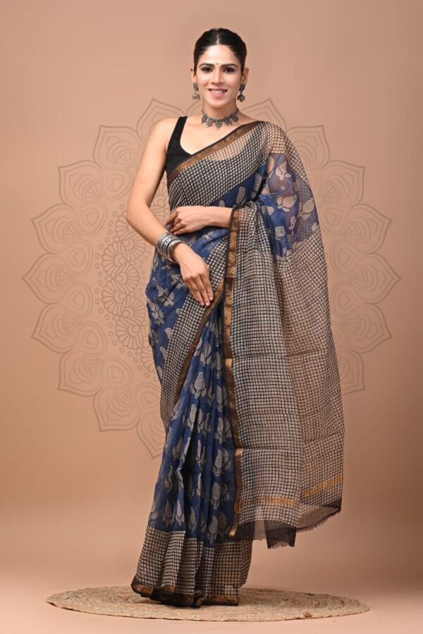 Woman wearing navy blue Kota Doria cotton saree with checkered print and paisley booti motifs