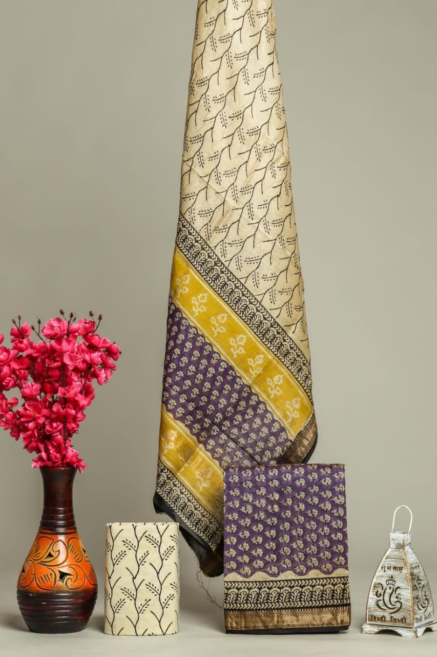 Cream Maheshwari silk dress material with hand block print leaf motif, mustard and purple floral border