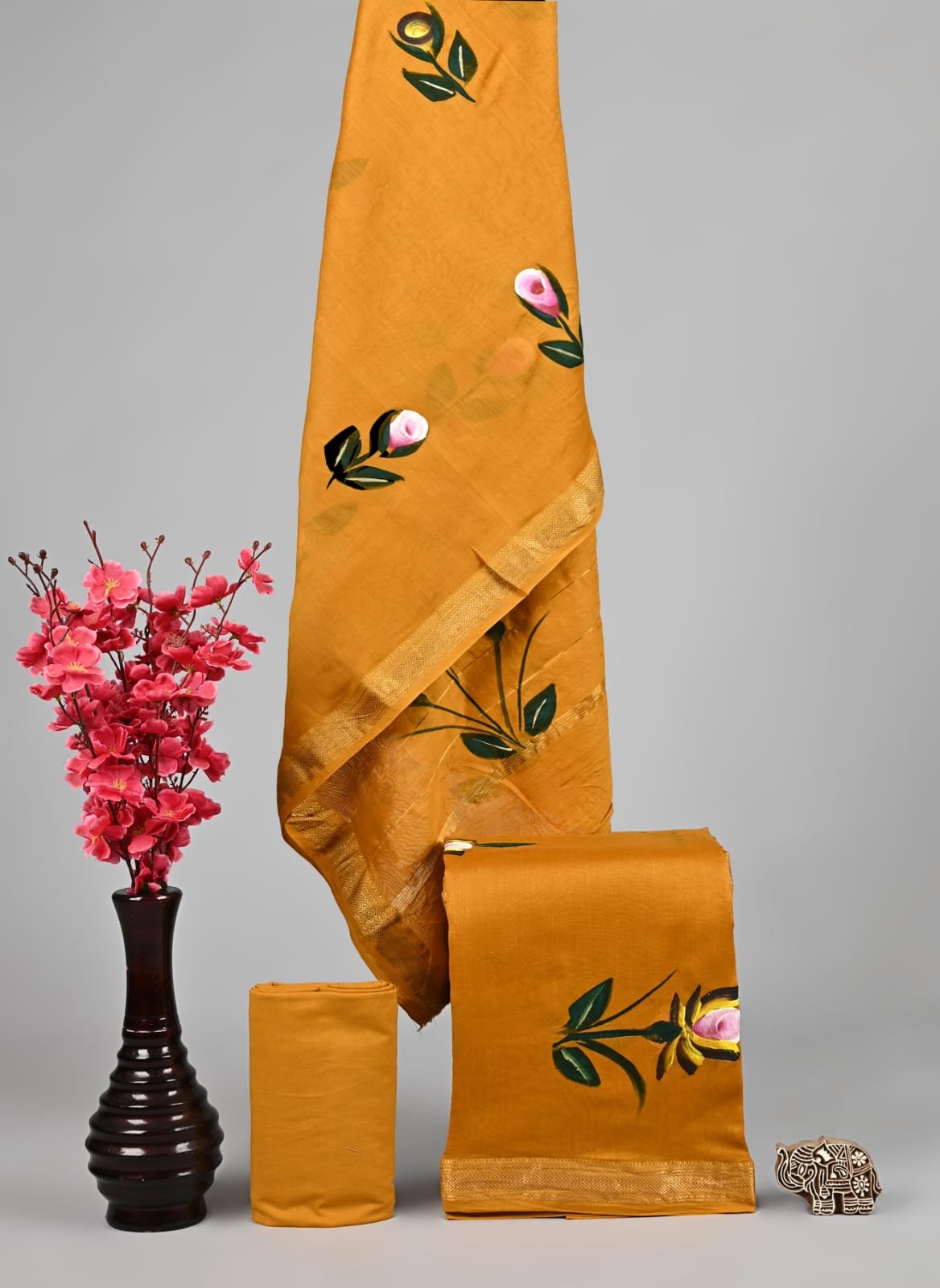 Mustard yellow Maheshwari silk suit dress material with painted floral motifs and golden zari border