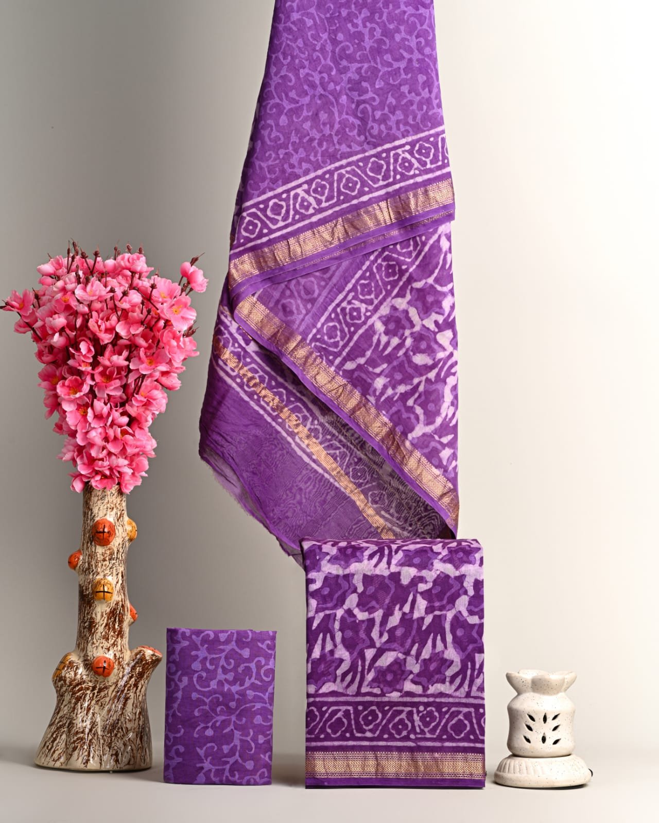 Purple Maheshwari silk suit with tone-on-tone vine print, diamond border and gold zari stripe dress material
