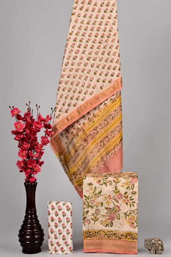 Cream Maheshwari silk suit with pink rosebud booti print and peach scroll-vine border, folded dress material
