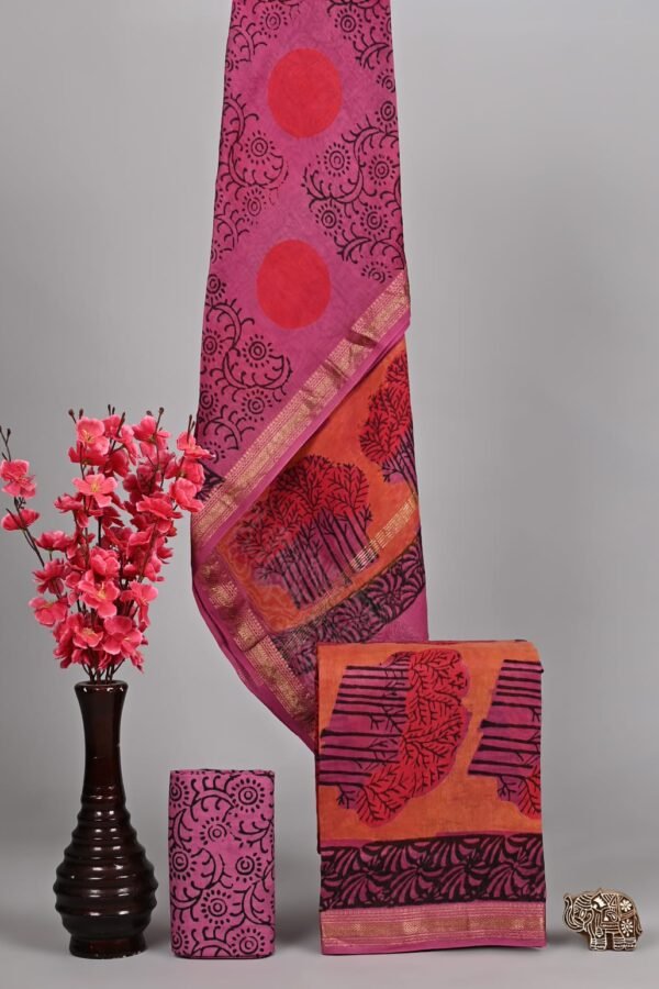 Magenta Maheshwari silk suit with red sunburst print and orange tree branch border with zari trim