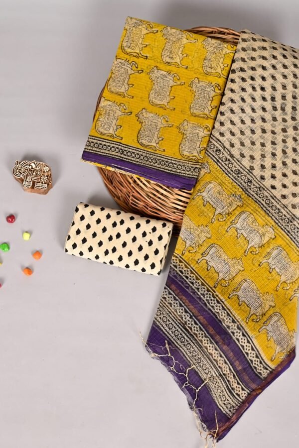 Mustard yellow Kota Doria suit fabric with elephant motif print and purple border, cream dotted dupatta