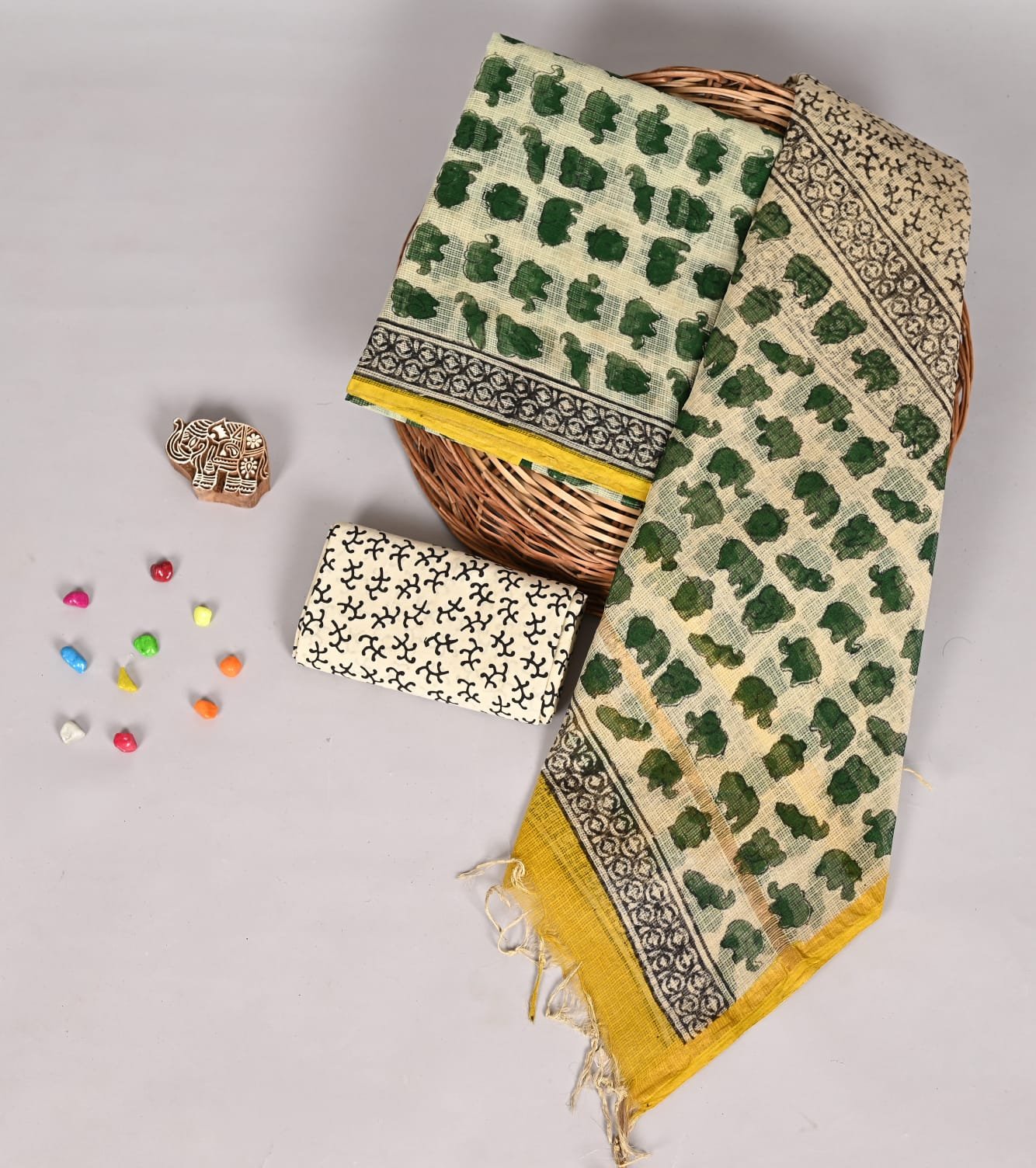 Cream Kota Doria suit fabric with green block-printed elephants and yellow bordered dupatta