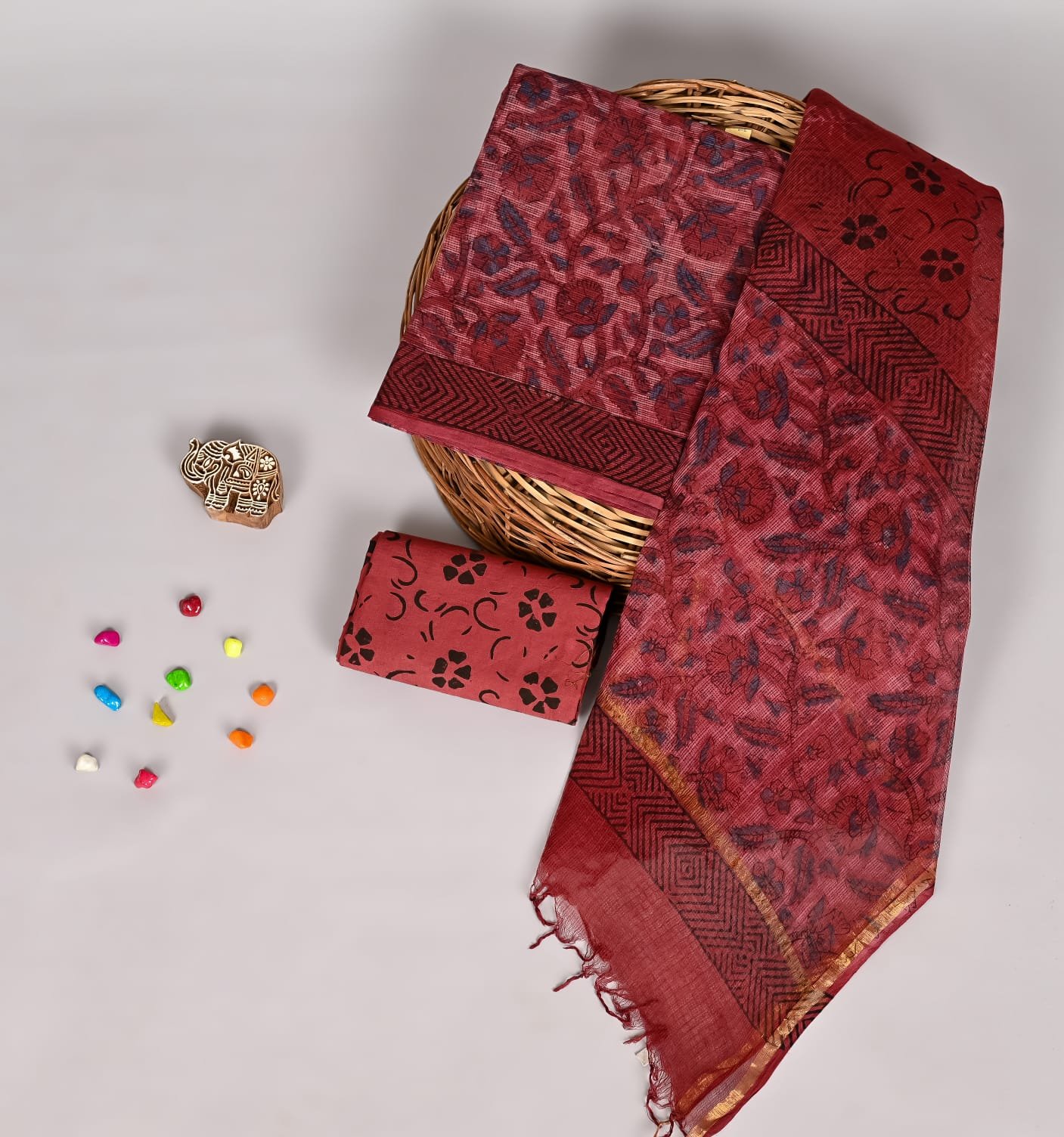 Maroon Kota Doria suit set with navy floral print and zigzag border dupatta
