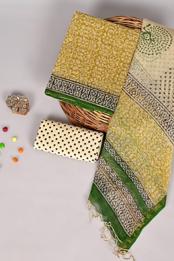Mustard yellow Kota Doria suit set with floral print, peacock dupatta, and polka dot fabric piece