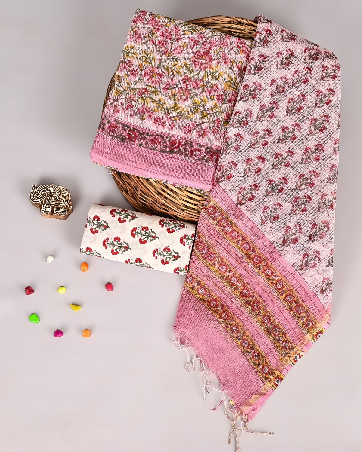 Pink Kota Doria suit set with red floral vine print and gold-stripe bordered dupatta