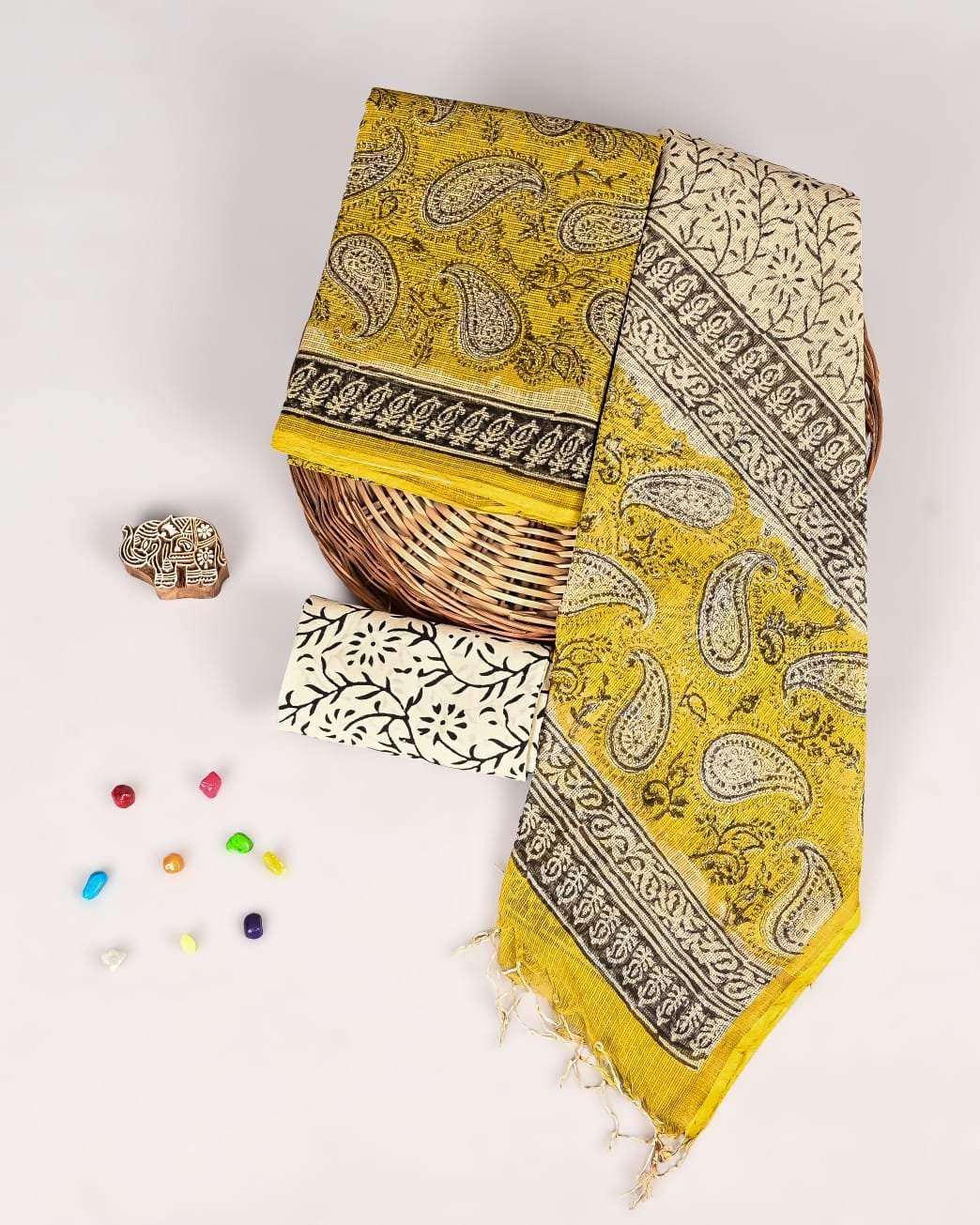 Mustard yellow Kota Doria suit with black paisley print and cream floral vine dupatta piece
