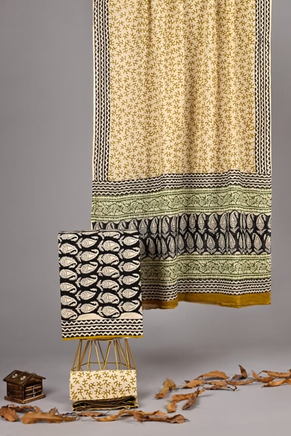 Cream cotton suit with mustard floral hand block print and black paisley border, shown with matching cotton dupatta