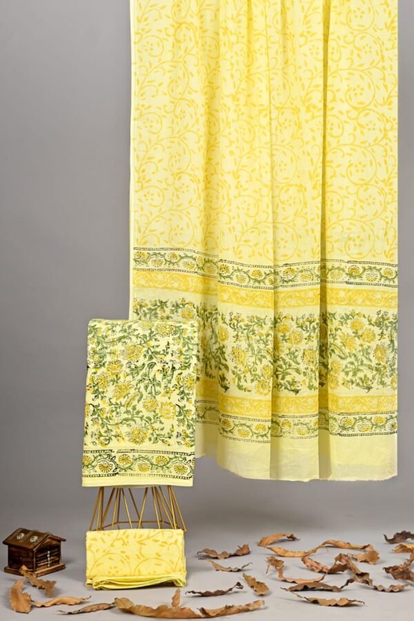 Yellow hand block printed cotton suit with green floral border and matching cotton dupatta