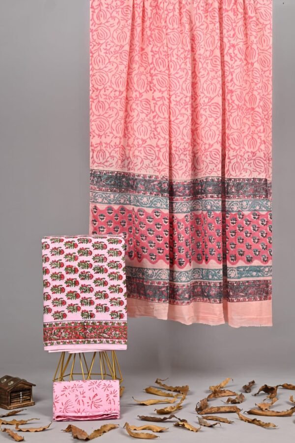 Peach hand block printed cotton dupatta with floral border, folded suit and bottom fabric alongside
